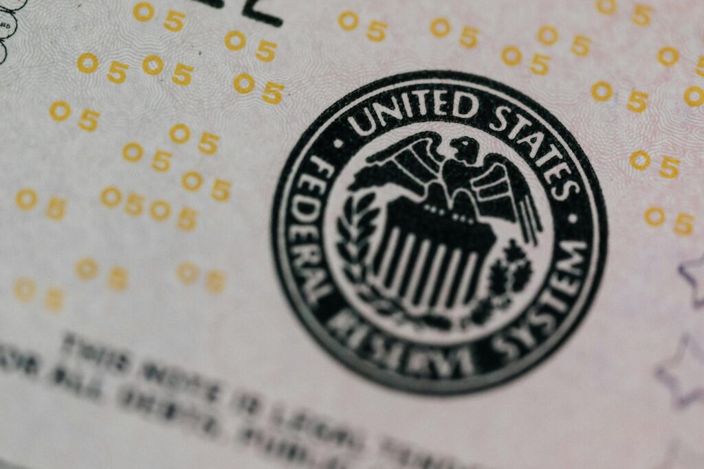 Detailed macro shot of the United States Federal Reserve System seal on paper currency.
